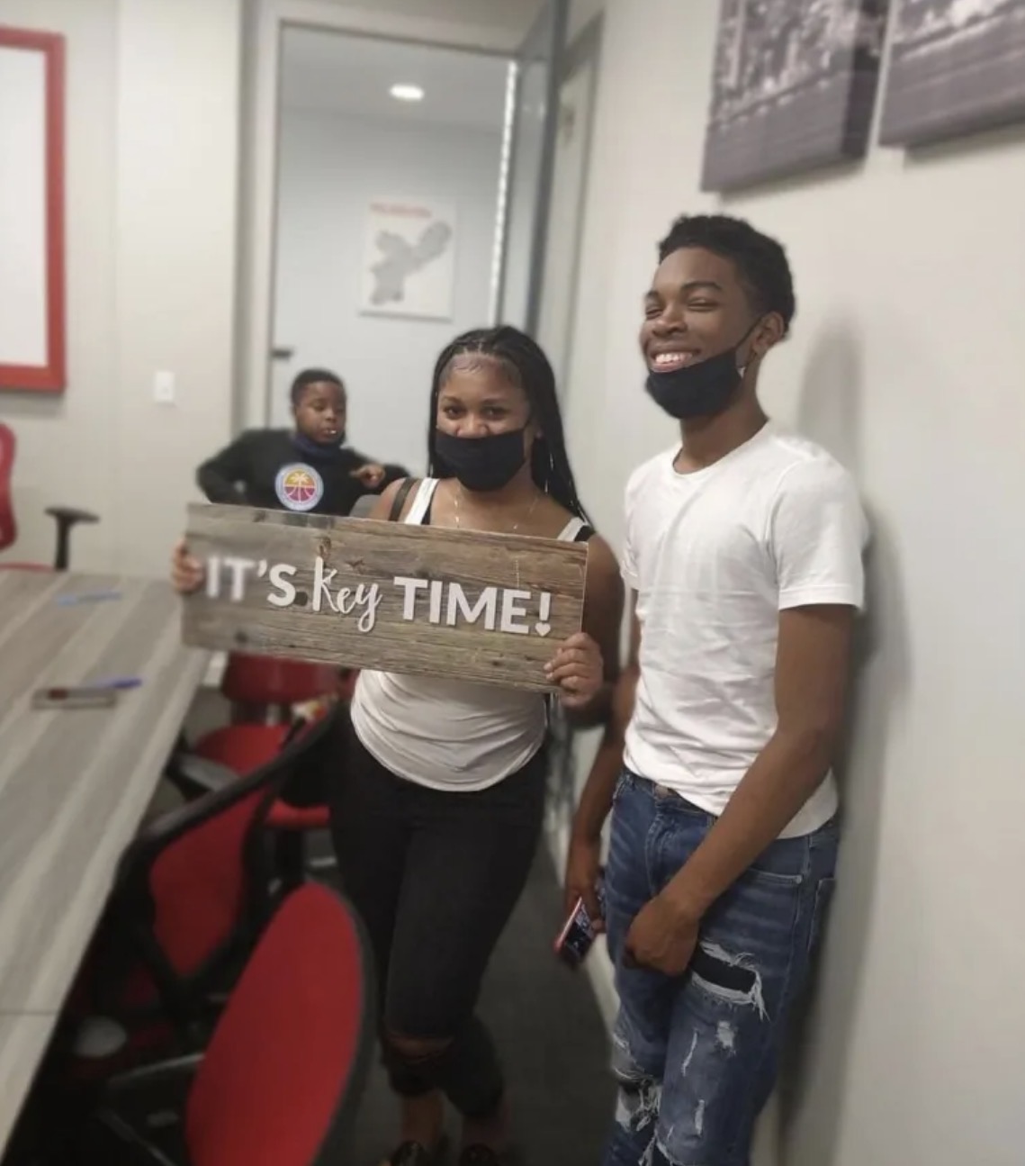 Client celebrating homeownership with keys